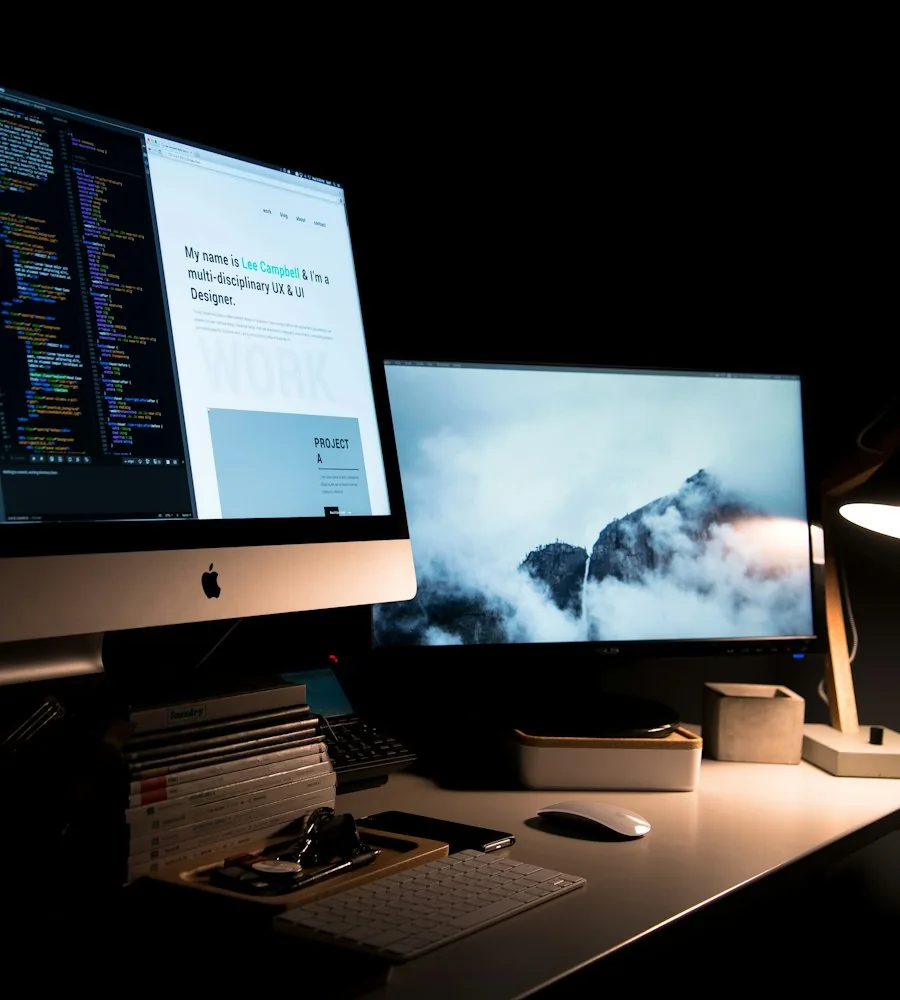 Developer reviewing custom website design layout on a laptop screen