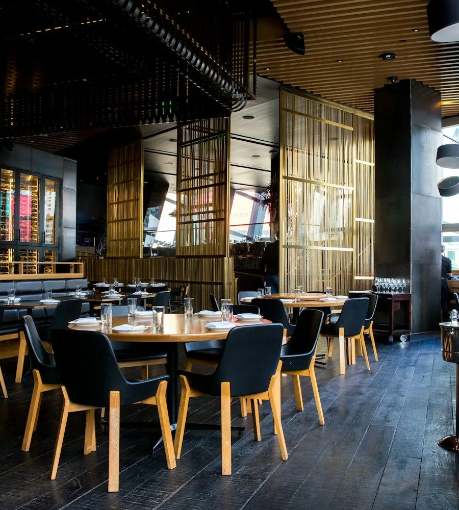 Restaurant interior with diners checking a menu on their phones