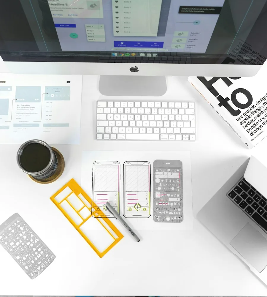 Designer reviewing wireframes and app screens on a tablet
