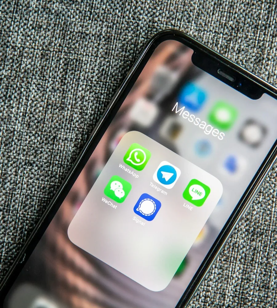 Smartphone displaying a WhatsApp Business chat conversation